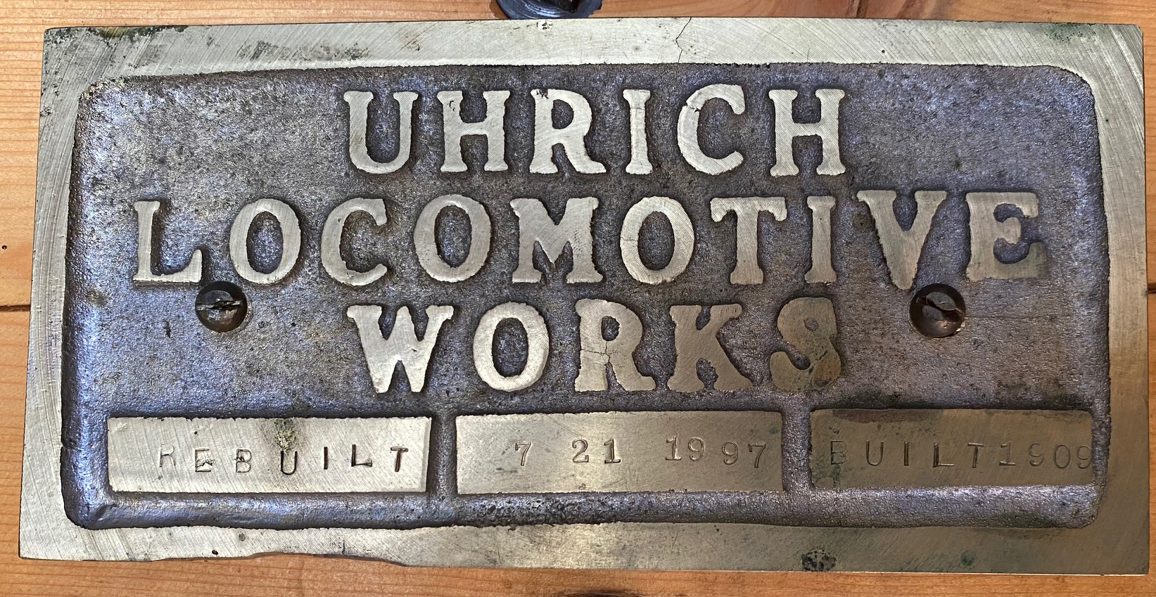 Uhrich Locomotive Works rebuild plate in Boxcar 8311.  It says built 1909, rebuilt July 1997. .jpg